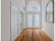 Bright foyer with chandelier, double doors, and hardwood floors at 3601 Galway Ln, Ormond Beach, FL 32174