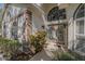 Welcoming front entrance features decorative glass doors and a large arched window for lots of natural light at 3601 Galway Ln, Ormond Beach, FL 32174