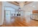 Expansive living room showcasing hardwood floors, natural light, and a pool view at 3601 Galway Ln, Ormond Beach, FL 32174