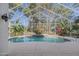 Enjoy the outdoors with a private screened-in pool area, lush greenery, and a sparkling pool at 3601 Galway Ln, Ormond Beach, FL 32174