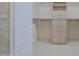 Custom walk-in closet with built-in shelving and drawers at 3601 Galway Ln, Ormond Beach, FL 32174