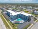 Beautiful building from an aerial view, with a pool and dedicated parking spaces at 3700 S Atlantic Ave # 413, New Smyrna Beach, FL 32169