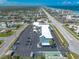An aerial view of a condo building featuring ample parking, and is located near the beach and the coastline of Florida at 3700 S Atlantic Ave # 413, New Smyrna Beach, FL 32169