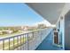 This balcony has railing and looks out over the neighborhood and ocean views at 3700 S Atlantic Ave # 413, New Smyrna Beach, FL 32169