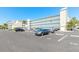 Spacious parking area outside Mariner's Cove building with ample spots at 3700 S Atlantic Ave # 413, New Smyrna Beach, FL 32169