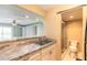 Stylish kitchen featuring a sink, countertops, and sliding door access to the bathroom at 3700 S Atlantic Ave # 413, New Smyrna Beach, FL 32169