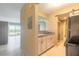 Efficient kitchen featuring a stylish countertop and a bathroom with a sliding door at 3700 S Atlantic Ave # 413, New Smyrna Beach, FL 32169