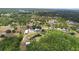 An expansive aerial view showcasing a property with ponds, barns, and natural beauty at 4145 Rambler Ave, St Cloud, FL 34772