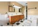 Bathroom boasts a double vanity with tile accents and ample storage at 4145 Rambler Ave, St Cloud, FL 34772