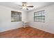 Bedroom with hardwood floors features two windows, letting in plenty of natural light at 4145 Rambler Ave, St Cloud, FL 34772