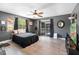 This bedroom features a slider to outside, wood look flooring and ceiling fan at 4145 Rambler Ave, St Cloud, FL 34772