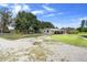 Cozy home featuring an inviting patio, fenced yard, and sunny, expansive acreage at 4145 Rambler Ave, St Cloud, FL 34772