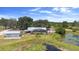 Inviting screened pool home with mature trees and a picturesque pond view at 4145 Rambler Ave, St Cloud, FL 34772
