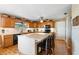 Well-lit kitchen with a kitchen island, granite countertops, and stainless steel appliances at 4145 Rambler Ave, St Cloud, FL 34772