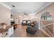 Spacious living room featuring hardwood floors, neutral paint, and cozy seating arrangements at 4145 Rambler Ave, St Cloud, FL 34772
