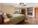 Spacious main bedroom features wood look flooring and a fireplace with tiled surround at 4145 Rambler Ave, St Cloud, FL 34772
