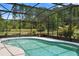 In-ground pool with a screen enclosure, perfect for year-round enjoyment and outdoor living at 4145 Rambler Ave, St Cloud, FL 34772