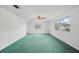 Spacious bedroom with a ceiling fan and large windows, bright and airy at 44 Fairway Cir, New Smyrna Beach, FL 32168