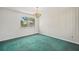 Dining room with chandelier, large window with lots of natural light at 44 Fairway Cir, New Smyrna Beach, FL 32168