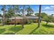 Charming brick ranch home with mature landscaping and a well-manicured lawn at 44 Fairway Cir, New Smyrna Beach, FL 32168