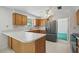 Traditional kitchen with stainless steel fridge and a breakfast bar counter for a functional space at 44 Fairway Cir, New Smyrna Beach, FL 32168