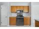 This kitchen includes a stainless steel microwave, oven, and stove with lots of cabinet space at 44 Fairway Cir, New Smyrna Beach, FL 32168