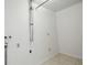 Clean laundry room with basic hookups, suitable for washer and dryer installation at 44 Fairway Cir, New Smyrna Beach, FL 32168