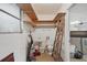 A utility room features shelving, sink, and toilet at 44 Fairway Cir, New Smyrna Beach, FL 32168