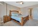 Comfortable bedroom featuring a wooden bed frame and coordinating wooden nightstands at 4670 Links Village Dr # A506, Ponce Inlet, FL 32127
