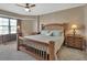 Comfortable bedroom featuring a wooden bed frame and coordinating wooden nightstands at 4670 Links Village Dr # A506, Ponce Inlet, FL 32127