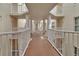 Exterior hallway providing a glimpse of unit entrances at 4670 Links Village Dr # A506, Ponce Inlet, FL 32127