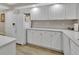 Spacious kitchen with white cabinets, ample counter space, and a refrigerator at 4670 Links Village Dr # A506, Ponce Inlet, FL 32127