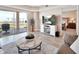 Comfortable living room with a fireplace and a view to the patio at 4670 Links Village Dr # A506, Ponce Inlet, FL 32127