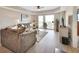 Bright living room with large sliding glass doors that lead to a balcony at 4670 Links Village Dr # A506, Ponce Inlet, FL 32127
