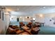 Spacious recreation room furnished with leather chairs, a ping pong table, and ample lighting at 4670 Links Village Dr # A506, Ponce Inlet, FL 32127