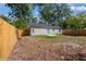 Backyard with new fence and some grass at 495 6Th St, Holly Hill, FL 32117