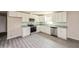 Modern kitchen with white cabinets, stainless steel appliances, and granite countertops at 495 6Th St, Holly Hill, FL 32117