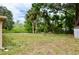 Expansive backyard featuring mature trees and lush greenery, offering privacy and natural beauty at 522 Grace Ave, Deland, FL 32724
