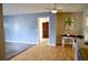 Spacious area featuring wood floors, blue walls, tan walls, and bright natural light at 522 Grace Ave, Deland, FL 32724