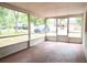 Screened-in back porch offers an outdoor relaxation space with views of the surrounding neighborhood at 522 Grace Ave, Deland, FL 32724