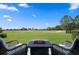 Beautiful backyard with comfortable seating and views of the golf course at 5430 Nw 35Th Lane Rd, Ocala, FL 34482