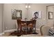 Cozy breakfast nook featuring a table with leather chairs and a horse hide rug at 5430 Nw 35Th Lane Rd, Ocala, FL 34482