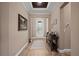 Welcoming entryway featuring tile floors, a decorative table, and a beautifully decorated front door at 5430 Nw 35Th Lane Rd, Ocala, FL 34482