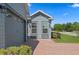 Exterior view featuring a gray siding, a garage, well maintained yard, and shrubbery at 5430 Nw 35Th Lane Rd, Ocala, FL 34482