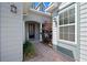 Charming front entrance with a brick pathway, lush landscaping, and a welcoming front door at 5430 Nw 35Th Lane Rd, Ocala, FL 34482