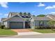Charming home with a well-manicured lawn and a two-car garage on a sunny day at 5430 Nw 35Th Lane Rd, Ocala, FL 34482