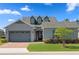 Charming home with well-maintained lawn, mature landscaping, and attached two-car garage at 5430 Nw 35Th Lane Rd, Ocala, FL 34482