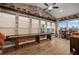 Game room with shuffleboard table, brick wall, and many windows at 5430 Nw 35Th Lane Rd, Ocala, FL 34482