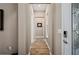 Inviting hallway featuring beautiful wood-look flooring and neutral paint throughout the home at 5430 Nw 35Th Lane Rd, Ocala, FL 34482