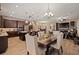Open-concept kitchen and living area with hardwood floors, seamlessly integrating culinary space and relaxation at 5430 Nw 35Th Lane Rd, Ocala, FL 34482